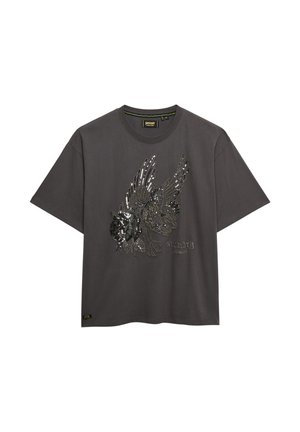 T-shirt gris foncé avec un motif détaillé de créature ailée en sequins noirs et argentés, accompagné du texte "Superdry Los Angeles" sur le devant.