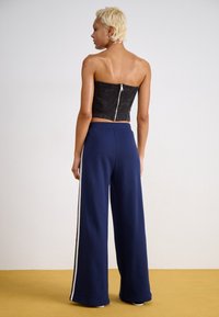 adidas Originals PANT - Spodnji deli trenirk - night indigo