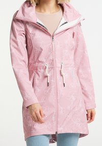 Veste imperméable rose avec motifs floraux blancs, cordons ajustables, fermeture éclair à l'avant et doublure intérieure douce. Dotée d'un col et de poches latérales.