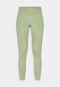 Legging taille haute en vert clair, fabriqué en tissu extensible avec une texture lisse ; présente des coutures plates et une silhouette ajustée.