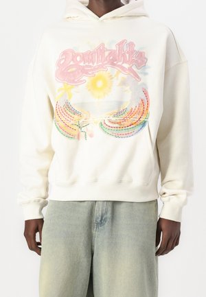 Kremowa bluza z kapturem z kolorowym graficznym wzorem przedstawiającym słońce i tęczowe pasma. Miękki materiał, luźny krój, ściągacze przy rękawach i u dołu.