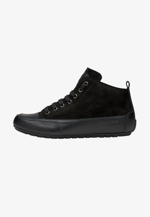 Black mid-top sneaker with suede upper, leather toe cap, lace-up closure, and pull tab on heel, side sole branding visible.