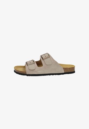 Beige suede sandal with two adjustable straps, cork footbed, and rubber outsole. Features a smooth texture and flat design.