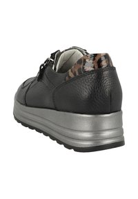 Black leather shoe with a textured finish, silver platform sole, and a leopard print accent at the heel. Side zipper for easy wear.