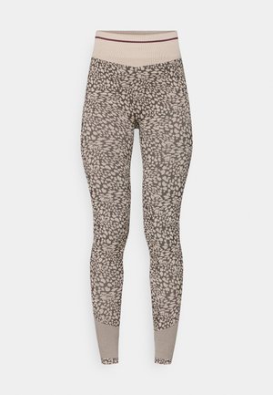 Leggings i en beige og brun dyreprint med en høj talje og elastisk linning samt teksturerede mønstrede detaljer nær anklerne.