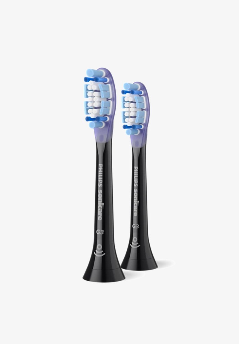 Deux têtes de brosse à dents Philips Sonicare G3 avec des manches noirs, des accents violets et de multiples poils bleus conçus pour un nettoyage efficace.