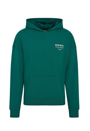 Tmavě zelená mikina s předním kapsou a bílým nápisem „LEGACY“ na levé horní části hrudi.