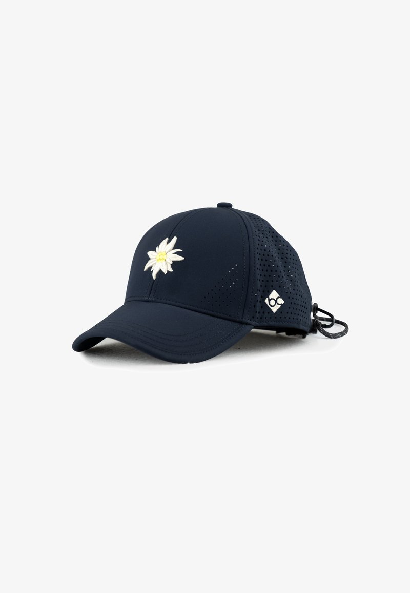 Navy blue cap with perforated sides, featuring a white embroidered daisy on the front and a logo on the side. Adjustable strap at the back.