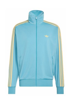 Light blue zip-up track jacket with high collar, yellow stripes down sleeves, and small yellow Adidas logo on left chest.