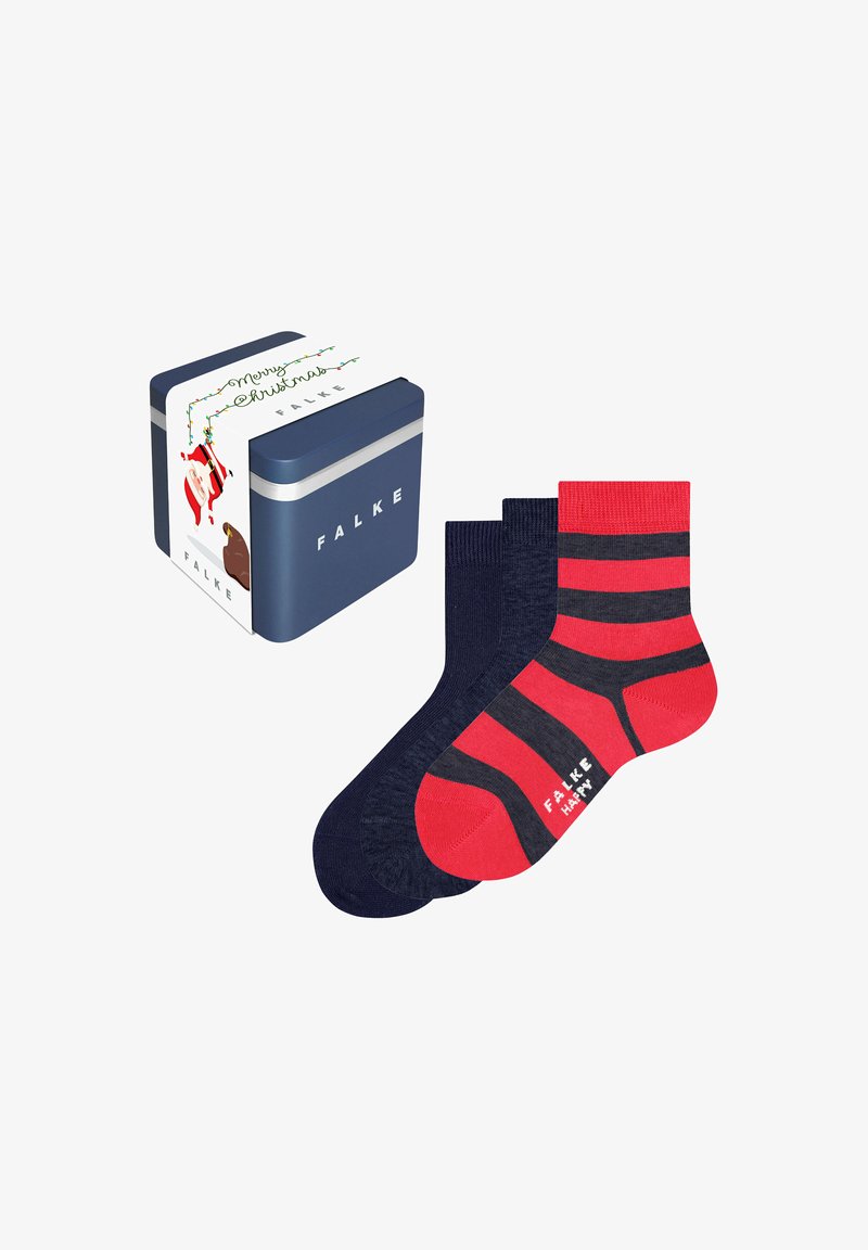 Trois paires de chaussettes Falke, deux bleu marine et une rouge avec des rayures noires, à côté d'une boîte cadeau bleu marine avec un emballage à thème de Noël.