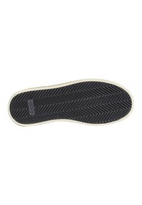 Suola di scarpa nera in gomma con motivo a coste, bordata da un orlo beige. Presenta un logo impresso sul lato.
