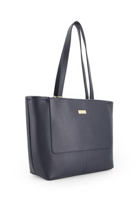 Navy leren totebag met een gestructureerde afwerking, een ritssluiting en een logo van gouden hardware. Voorzien van dubbele handvatten voor het dragen.