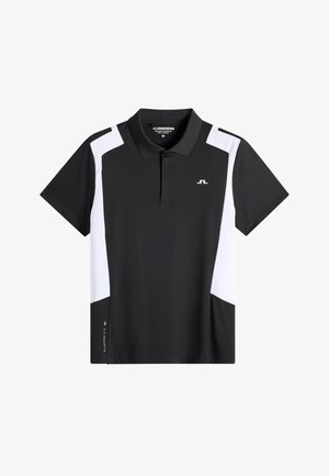 Polo a maniche corte bianco e nero con collo, design a blocchi di colore, piccolo logo sul petto e nome del marchio vicino all'orlo.