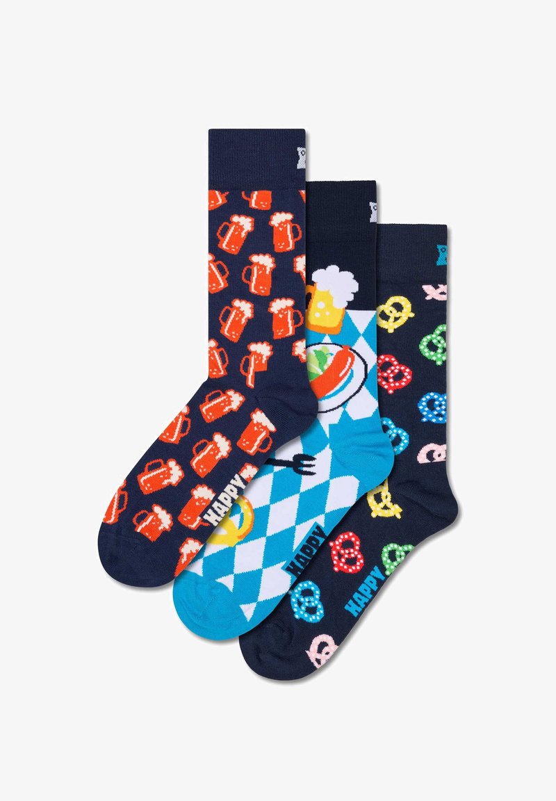 Tri pari nogavic, ki prikazujejo živahne vzorce pivskih vrčev, peciv in modrega diamantskega ozadja z motivi hrane. Mešanica bombaža.