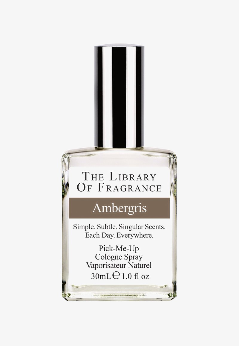 Przezroczysta szklana butelka o prostokątnym kształcie, srebrna nakrętka i etykieta z nadrukiem. Etykieta zawiera nazwę produktu "Ambergris" oraz szczegóły dotyczące zapachu.
