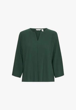 Žalia, raukšlėta bluzonė su V formos iškirpte ir trimis ketvirčiais rankovėmis. Minkšta tekstūra, laisvas sijonas ir minimalistiškas dizainas be papildomų akcentų.