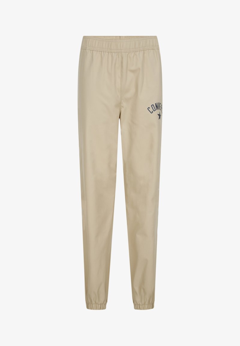 Beige Jogginghosen mit elastischem Bund, versehen mit einem kleinen navy blauen "Converse"-Logo und Stern. Glattes, leichtes Material, mit schmal zulaufenden Bündchen.