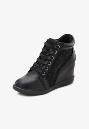 Black wedge sneakers with a smooth leather upper, lace-up front, and lace detailing on the sides. Features rubber sole and rounded toe.