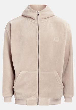 Beige fleece hoodie with a full zipper, hood, and two front pockets. Features ribbed cuffs and an embroidered logo on the left chest.
