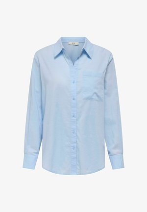 Ανοιχτού μπλε πουκάμισο με μακριά μανίκια, κολάρο που κλείνει με κουμπιά, μπροστινή τσέπη και λεία υφή. Διαθέτει κουμπιά σε πλήρη αντιστοιχία μπροστά.