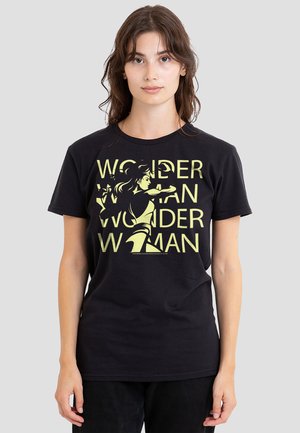 Black cotton t-shirt featuring a graphic of Wonder Woman, with bold yellow text reading "WONDER WOMAN" and an illustration of the character.