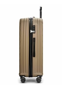 Harde, beige koffer met gekartelde textuur, zwarte rits en handvat, TSA-slot en vier spinner wielen voor gemakkelijke mobiliteit.
