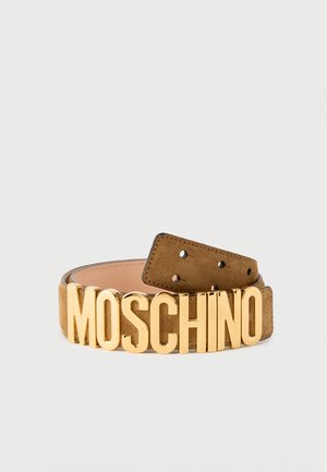Brown suede belt with large gold letters spelling "MOSCHINO" as the buckle, rolled with visible adjustment holes on one end.