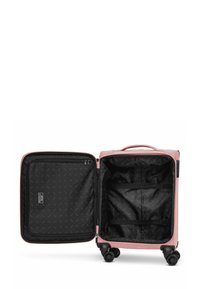 Valigia rigida di un delicato rosa, con interno nero e motivo geometrico, tasca con zip e cinghie di sicurezza. Quattro ruote nere.
