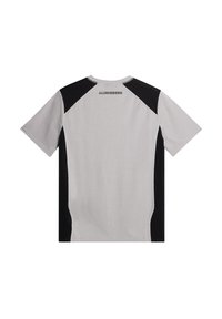 Kortärmad T-shirt i ljusgrått med svarta sidopaneler, med rund halsringning och en logotyp på övre ryggen. Mjuk, slät textur.