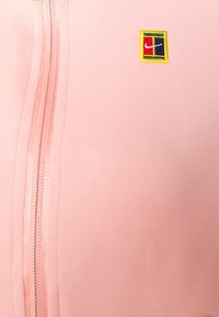 Nike Performance HERITAGE JACKET - Casaco de treino - bleached coral