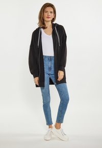 usha Felpa con zip - schwarz