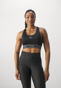Puma KEEPS BRA - Športni modrček s srednjo podporo - black