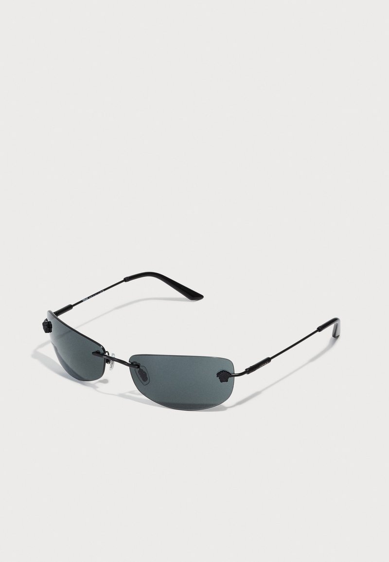 Sunglasses with a sleek black metal frame, dark tinted lenses, minimalist design, and adjustable nose pads for comfort.