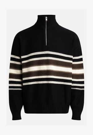 Mustmustärgiga sviiter, millel on kõrge krae ja lukuga valekaelus. Omab horisontaalseid triipesid beeži, pruun ja valge värviga. Kootud tekstuur ribakättega.