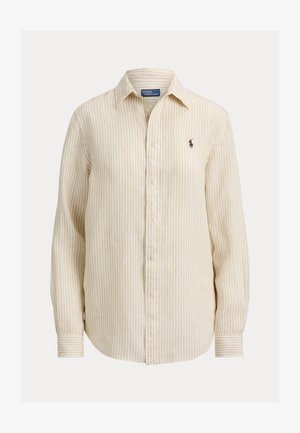 Beige ja valkoinen pystysuora raidallinen pitkähihainen nappikauluksellinen paita, jossa vasemmassa rinnassa pieni kirjailtu logo.