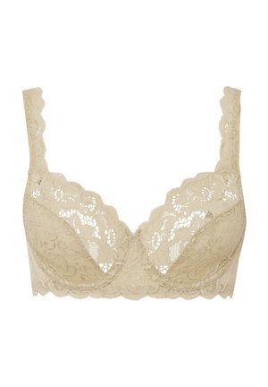 Beige kant beha met een golvende rand, bloemenpatroon, semi-transparante cups en verstelbare bandjes. Geen beugel, biedt zachte ondersteuning.