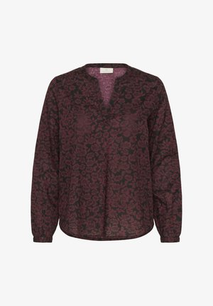 Long-sleeve blouse in burgundy with a floral pattern. Features a V-neckline and relaxed fit. Made from lightweight fabric with a smooth texture.