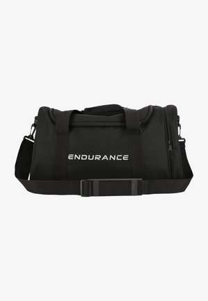 Schwarze Duffel-Tasche mit verstärkten Trägern, Reißverschluss oben, flachem Boden und dem Wort "ENDURANCE" in Weiß auf der Vorderseite aufgedruckt.