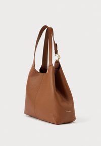 Brown textured leather shoulder bag with two straps and gold clasp detail, standing against a plain light background.