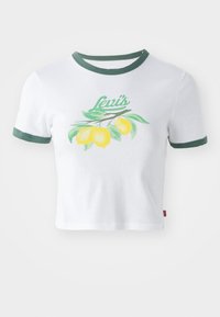 Vit crop top med grön krage och ärmslut, med en citrongren och grön "Levi's" text på bröstet.