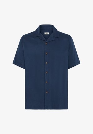Chemise à manches courtes bleu marine en tissu lisse, avec un col classique et cinq boutons marron sur le devant.