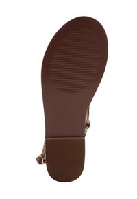 Suola di scarpa in gomma marrone con scanalature testurizzate, forma leggermente ovale e tallone rinforzato. Presenta una superficie liscia e un colore uniforme.