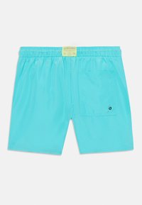 Pantaloni de baie turcoaz cu talie elastică, dotat cu un buzunar pe spate și un mic etichetă cu logo în centrul taliei.