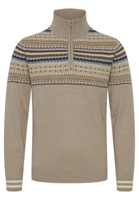 Beige színű, cipzáros pulóver, barna, tengerészkék és krémmintázattal. Bordás gallérral és mandzsettával rendelkezik, puha tapintású, hosszú ujjú.