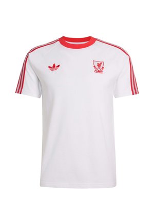 Biely športový krátky rukáv s červeným golierom, červenými pruhmi na rukávoch, logom Adidas na ľavej strane a erbom futbalového klubu Liverpool na pravej hrudi.