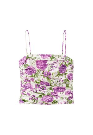 Débardeur court blanc à fines bretelles, avec un motif floral violet et vert et des détails froncés.