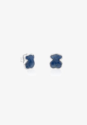 Boucles d'oreilles en argent en forme d'oursons, avec des incrustations de pierres bleu foncé, présentées sur un fond blanc.