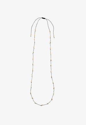 Black cord necklace with gold-tone beads, featuring a long, thin design. Beads are unevenly spaced along the cord, secured with adjustable ties.