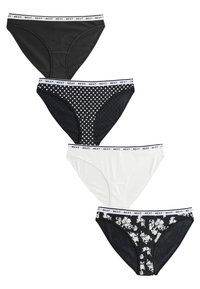 Quatre culottes pour femmes : deux unies noires, une blanche, et une noire à motif floral. Toutes disposent d'une ceinture blanche avec le logo "NEXT".