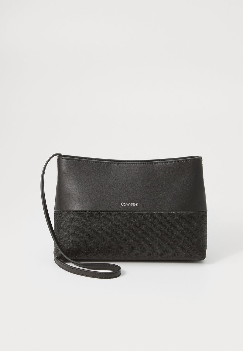 Black clutch bag with a smooth top and textured lower half featuring a logo. It includes a detachable strap for carrying.